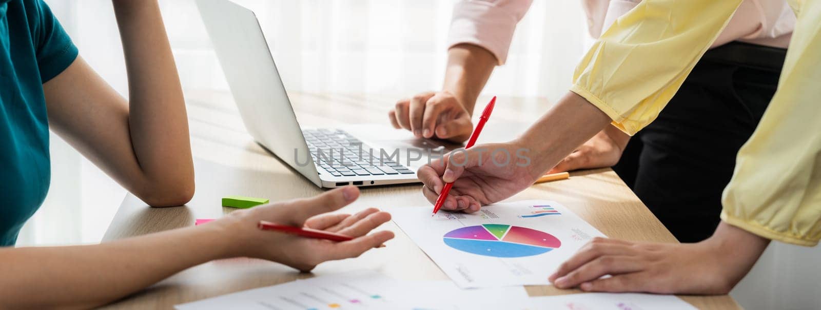 Startup company employee working together, analyzing BI dashboard paper on financial data report and planning strategic marketing for business success in panorama banner. Synergic