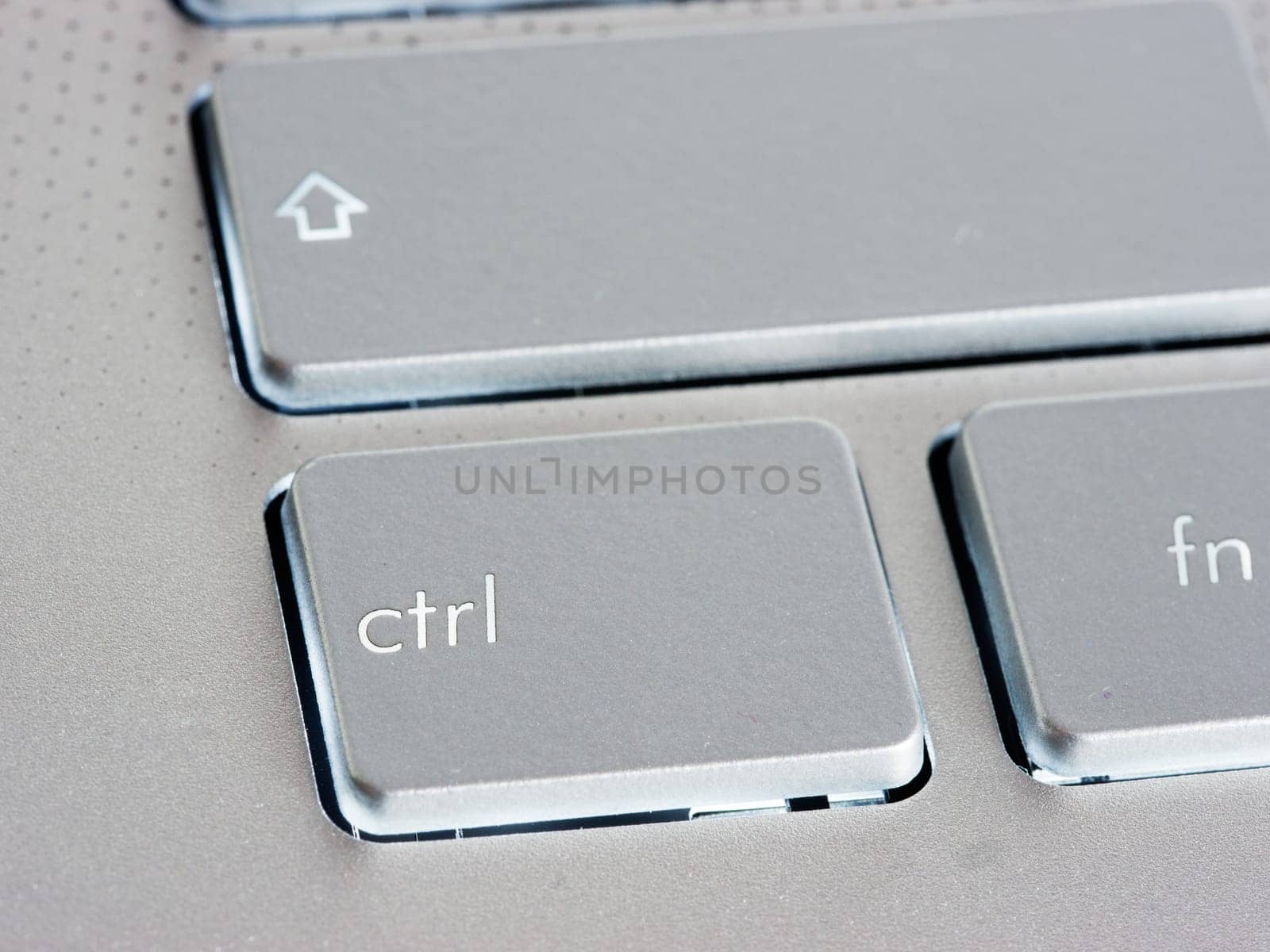 Ctrl - Control key on silver laptop keyboard by fascinadora