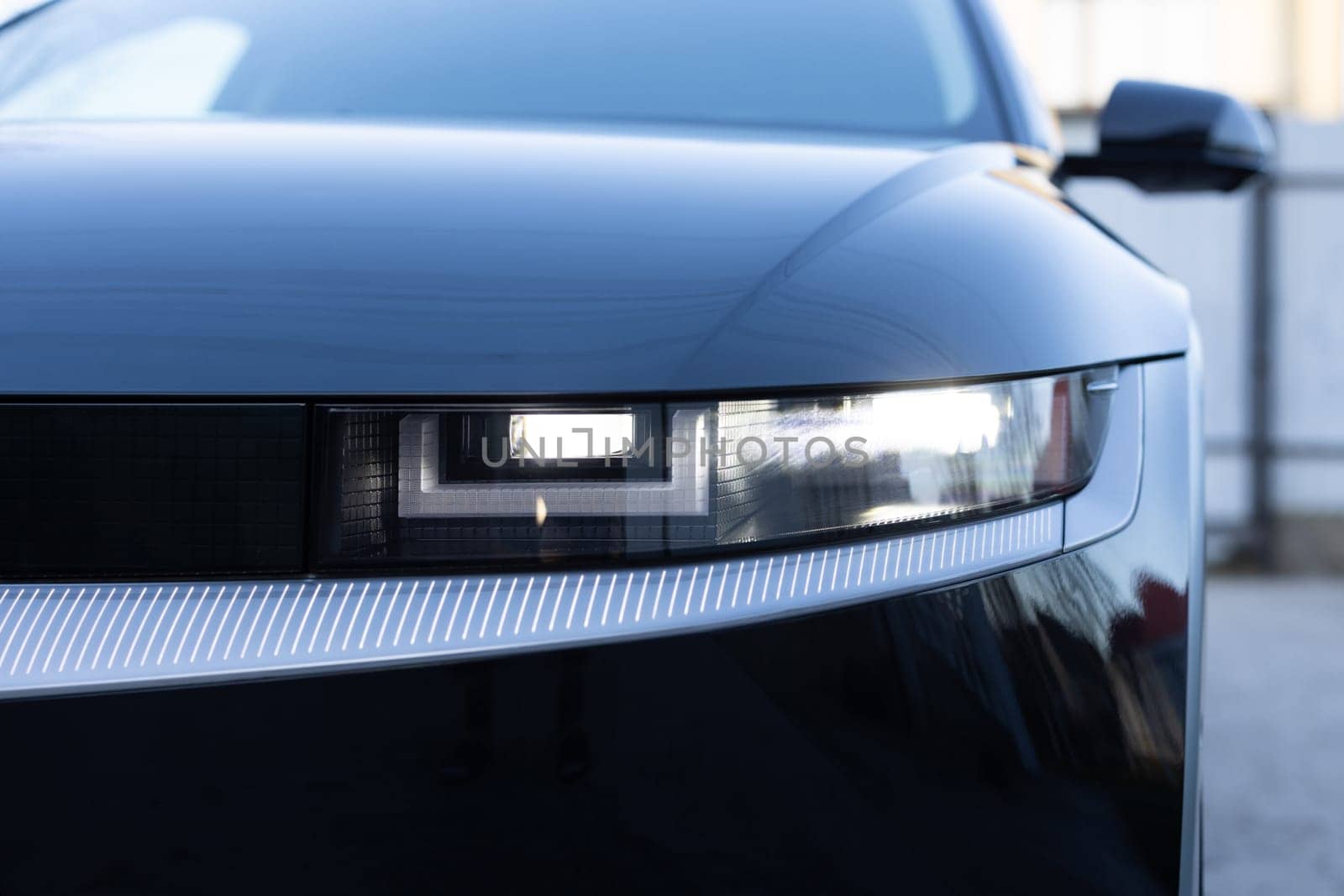 Modern car headlamp flashing light with blinking on continuously indicator. Switched on led matrix lights of luxury car. Car Blinker Light. Car front full led matrix Light.