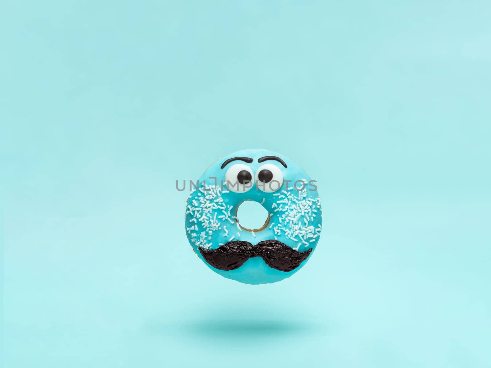 Blue glazed donut with mustache flying by fascinadora