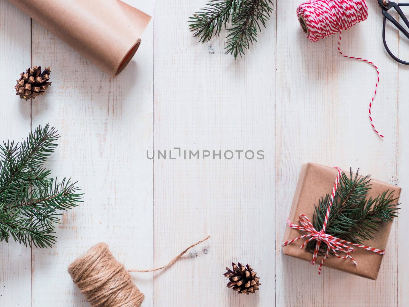 Christmas gift wrapping background, copy space for text or design in center. Winter holidays concept, flat lay or top view.