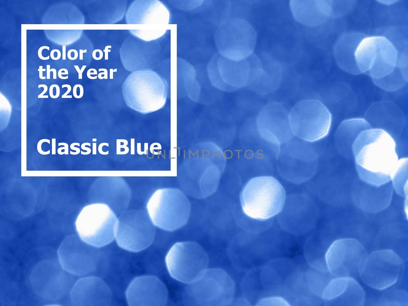 Sparkling background with bokeh made of Classic Blue 2020 color. Color of year 2020 blurred backdrop for holidays and parties. COY2020 Classic Blue concept. Copy space for text