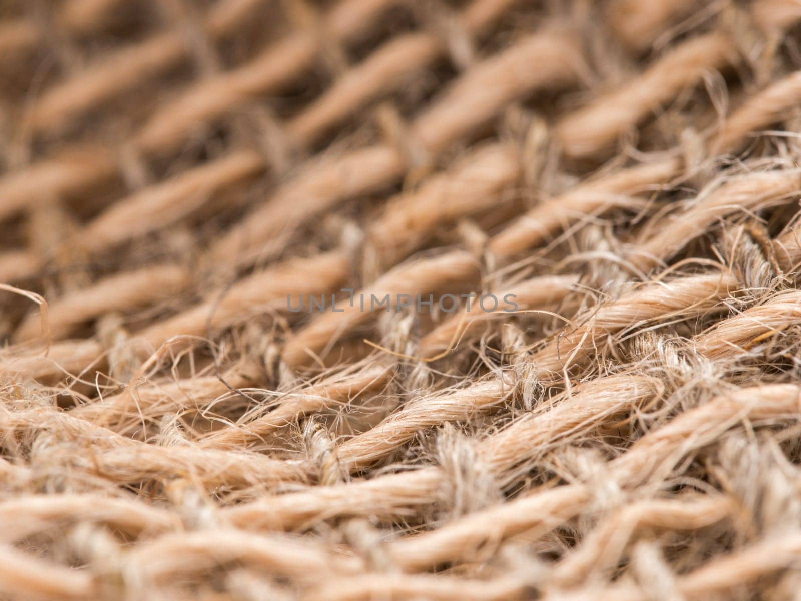 Skein of jute twine on sacking. Clew of natural rope. Close up