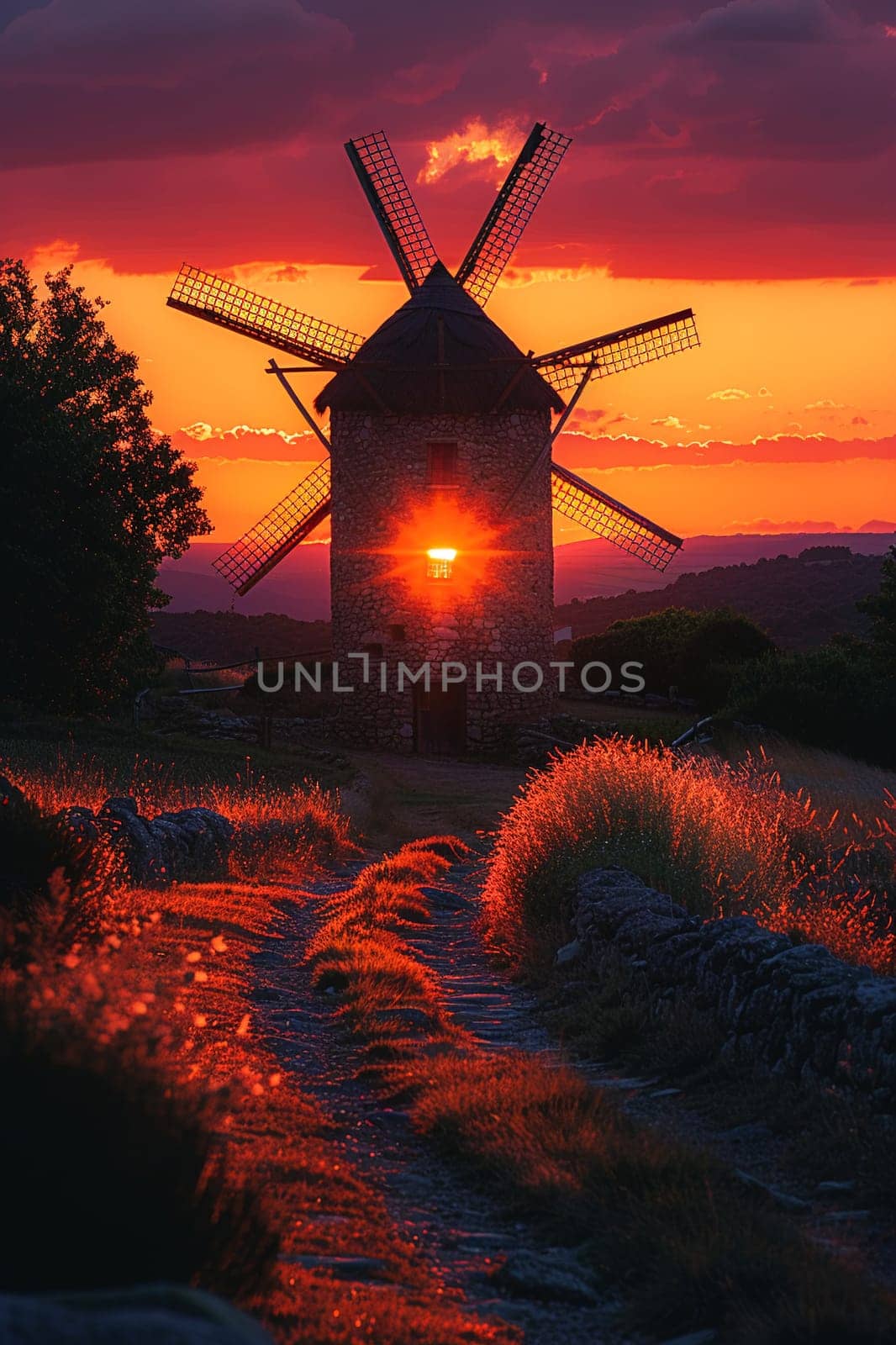 Traditional Windmill Silhouetted Against a Setting Sun, The sails blur with the sky, the romance of history outlined in twilight.