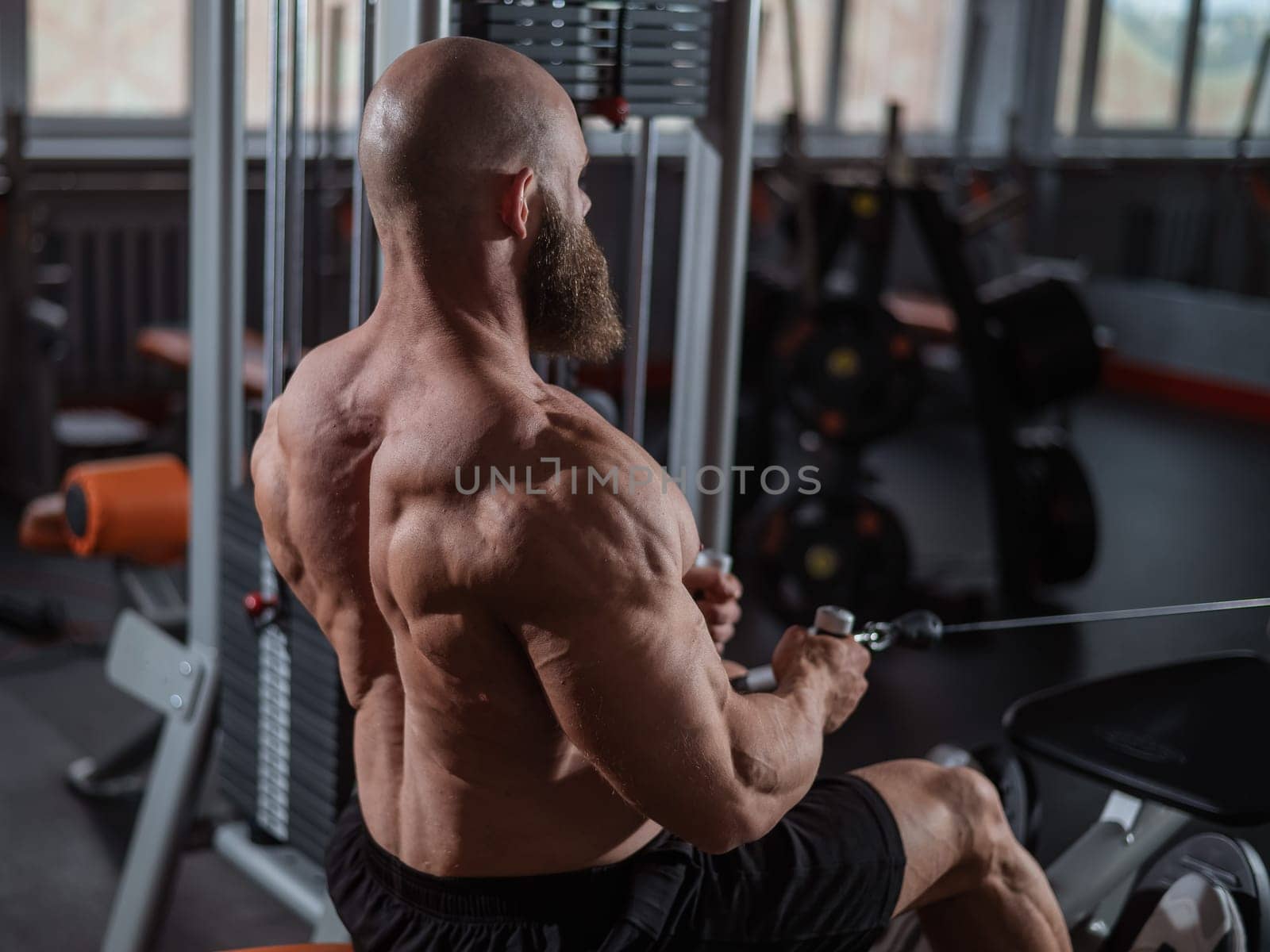 Caucasian man doing rowing exercises on a rowing machine