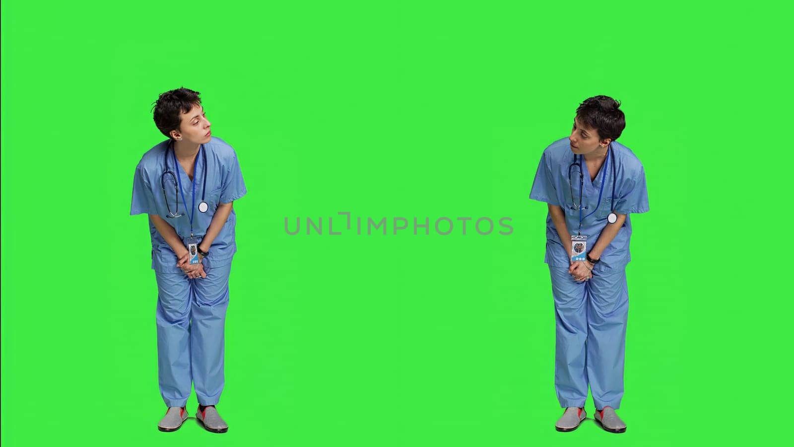 Medical assistant being impatient against greenscreen backdrop by DCStudio