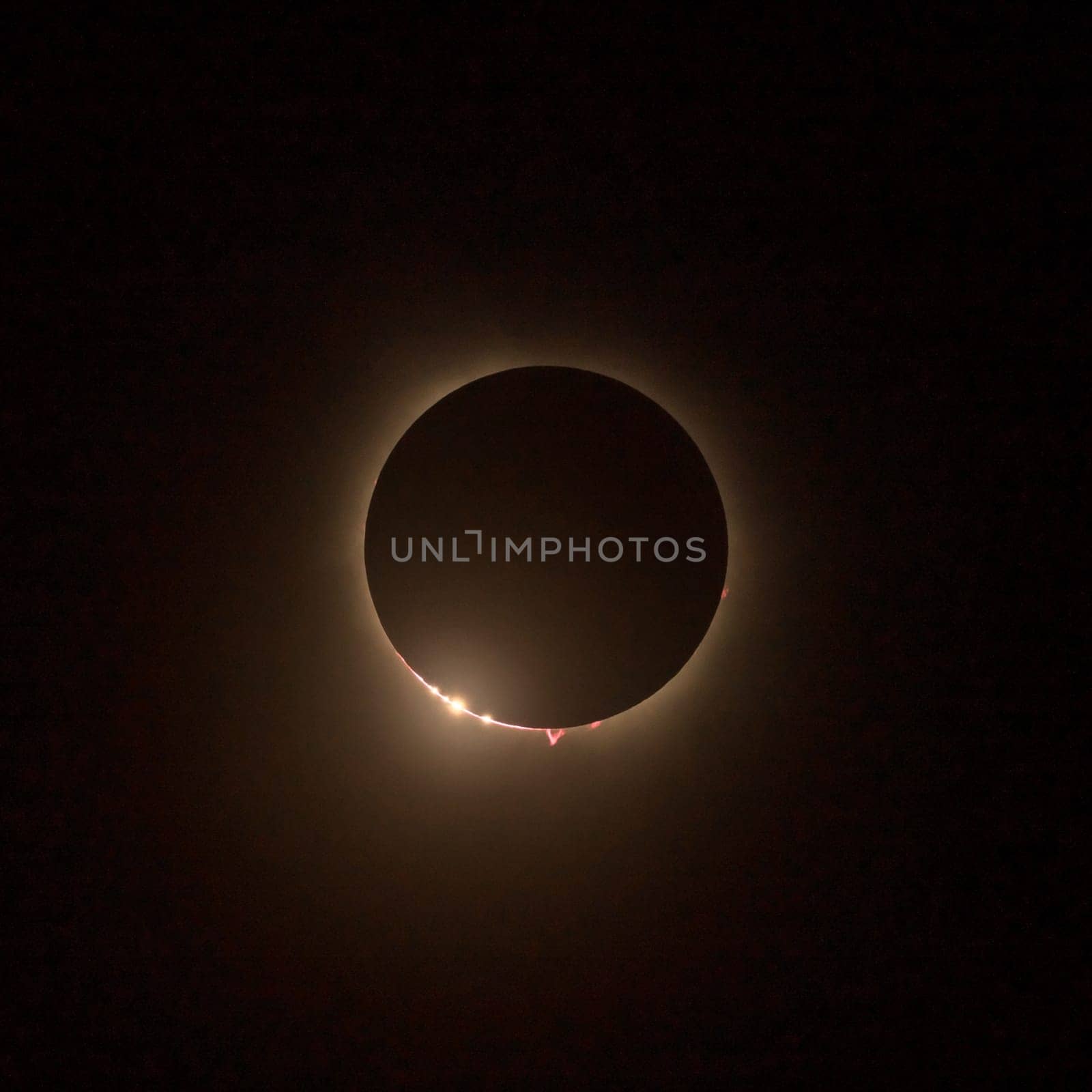 Solar eclipse with the light being seen through lunar canyons. by steheap