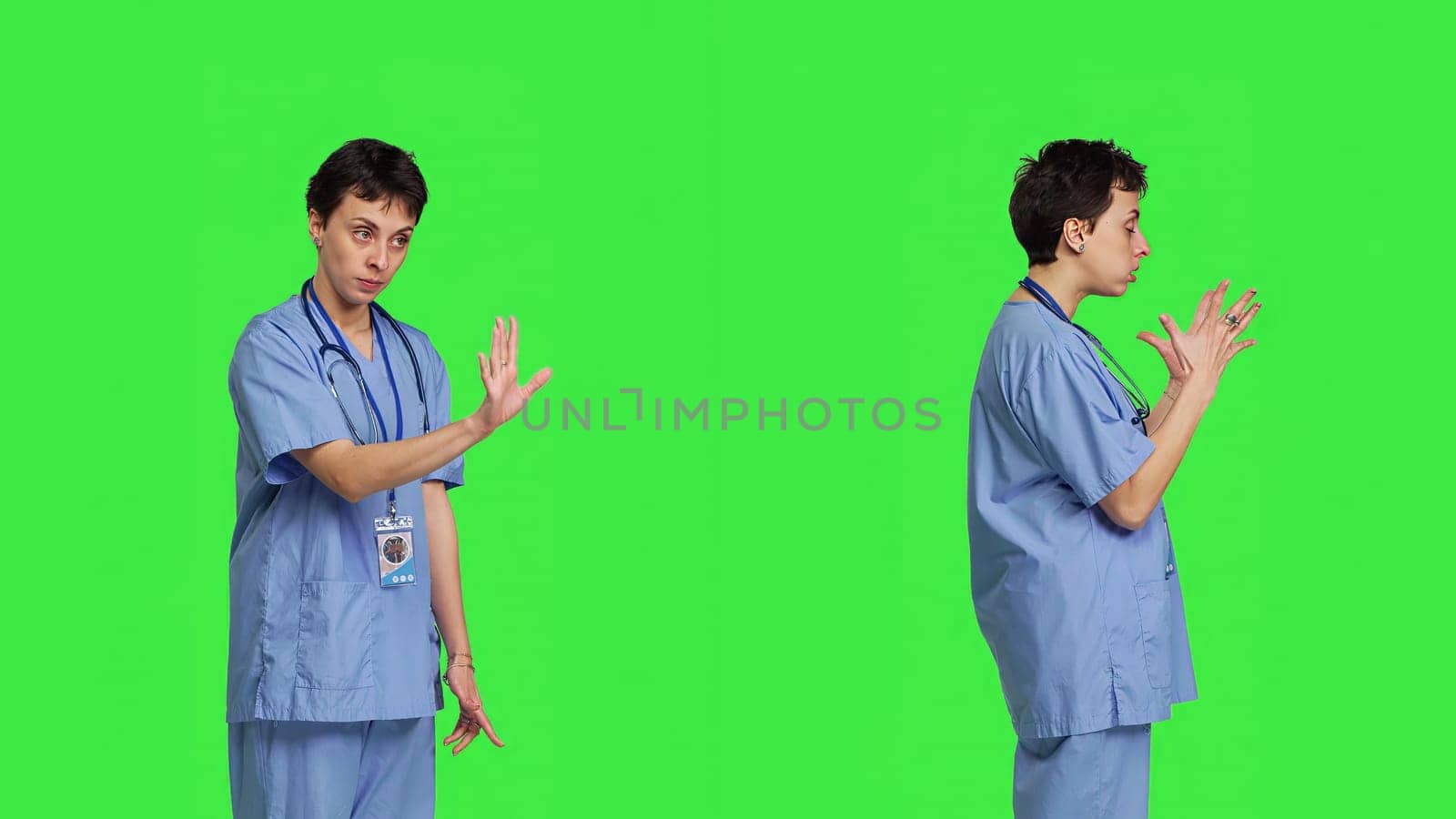 Displeased irritated nurse shouting no and arguing with someone against greenscreen backdrop, showing rage and anger while she wears hospital scrubs. Aggressive medical assistant. Camera B.