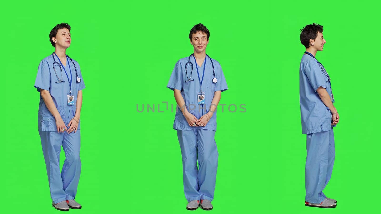 Portrait of medical assistant smiling and posing with confidence, standing against greenscreen backdrop. Nurse wears blue scrubs and stethoscope, feeling successful with health expertise. Camera A.