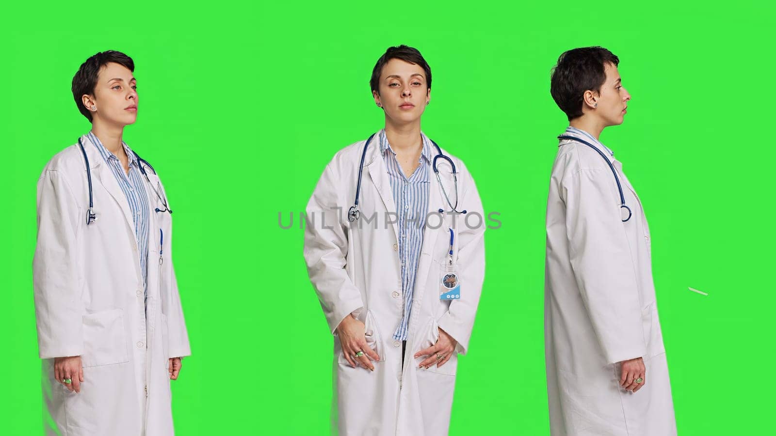 Portrait of health specialist wearing a white hospital coat in studio by DCStudio