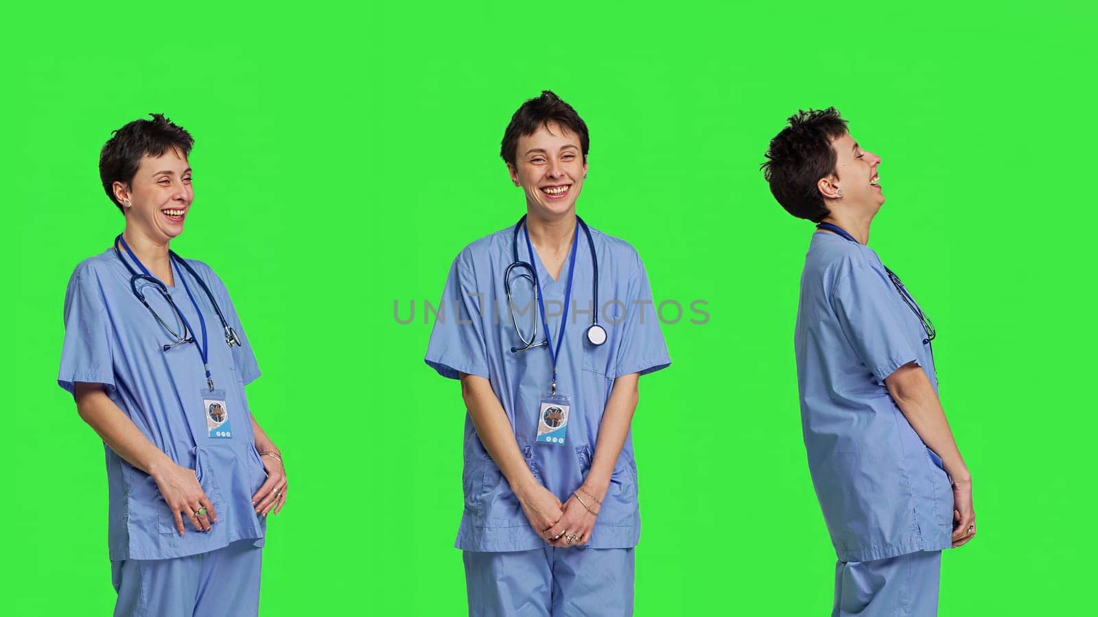 Cheerful smiling medical assistant standing against greenscreen backdrop, feeling confident and successful while she wears hospital scrubs. Nurse surgeon works in healthcare industry. Camera B.