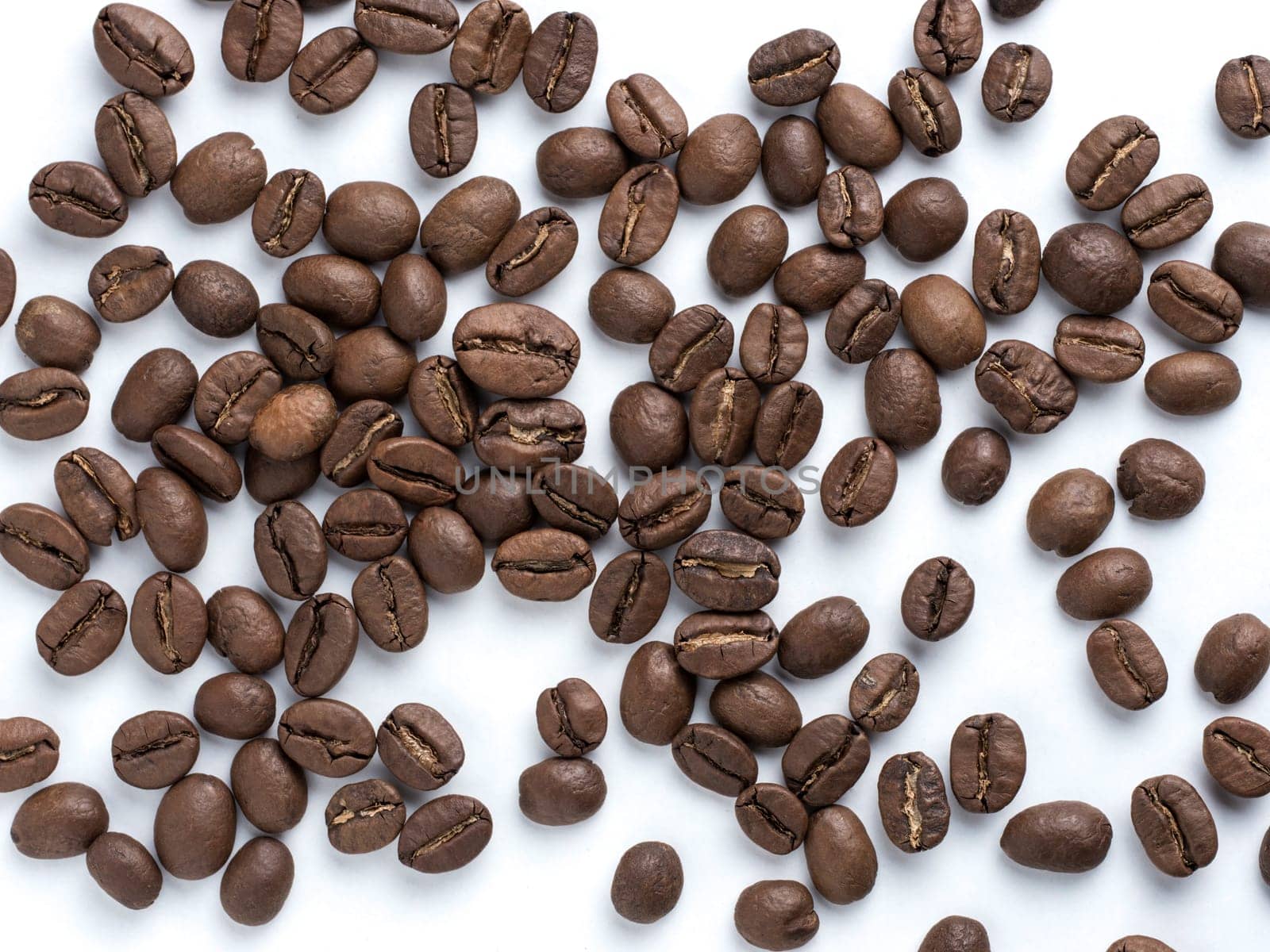 Coffee beans closeup on white background by fascinadora