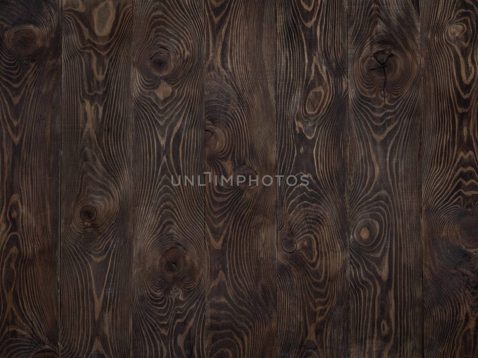Wood background. Dark wooden texture empty surface. Copy space for text and design. Dark brown larch rustic wooden table top. vertical stripes of boards