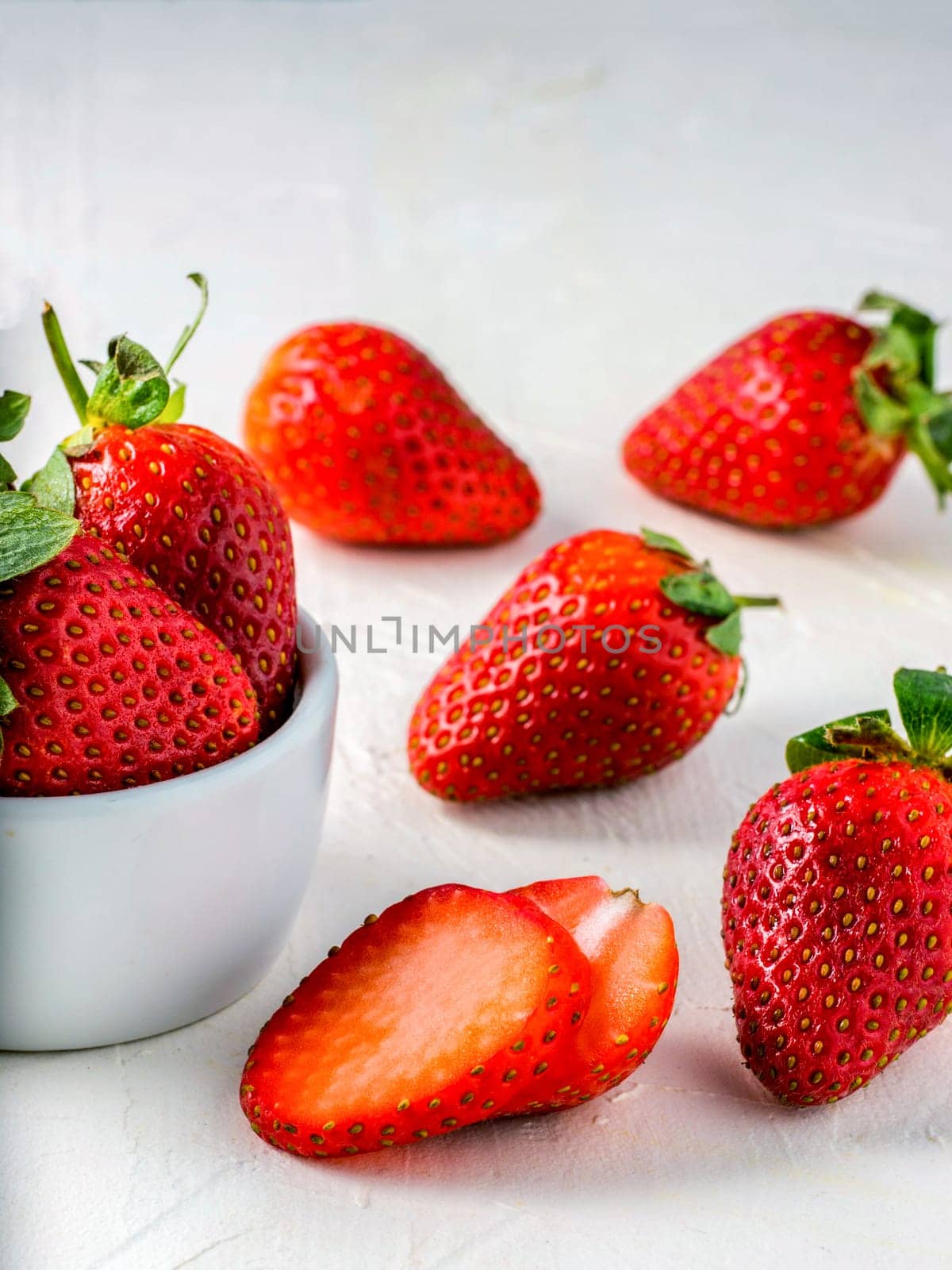 strawberries in wooden bowl by fascinadora