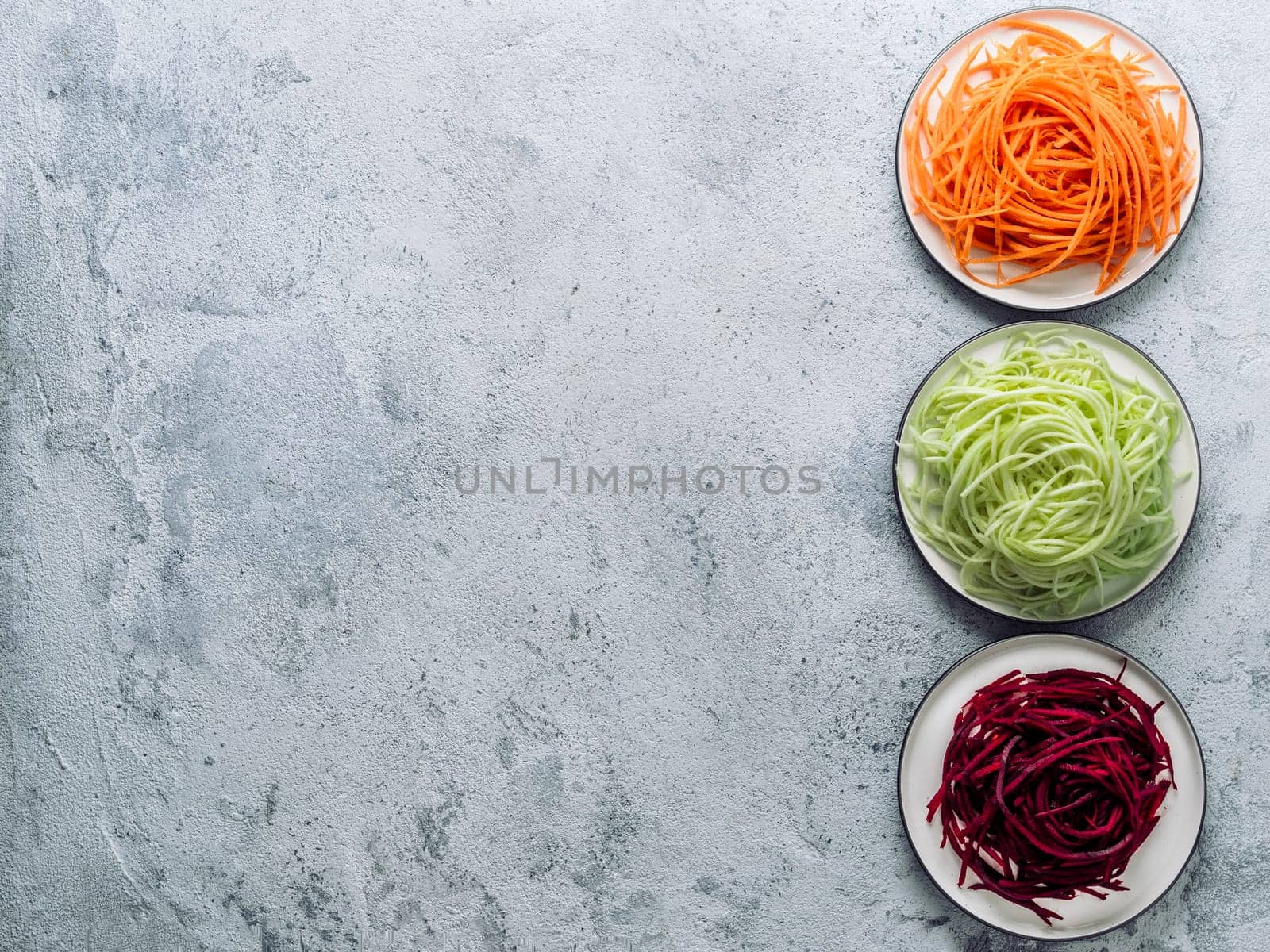 zucchini, carrot, and beetroot noodles, copy space by fascinadora