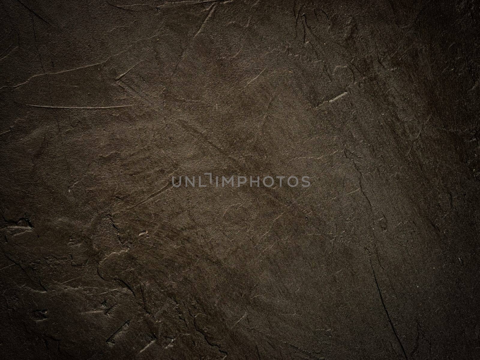 Dark grunge textured wall close up as background. Black textured backdrop for design or text. Copy space