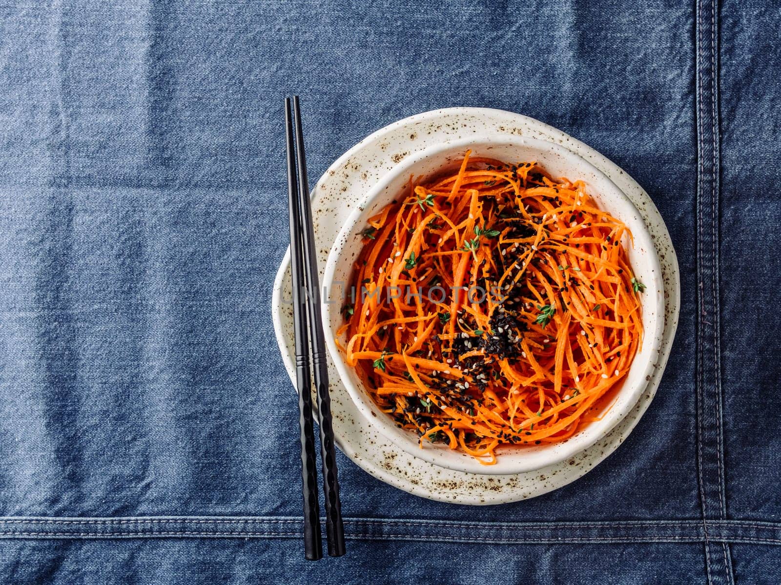 Raw carrot noodles or spaghetti, top view by fascinadora