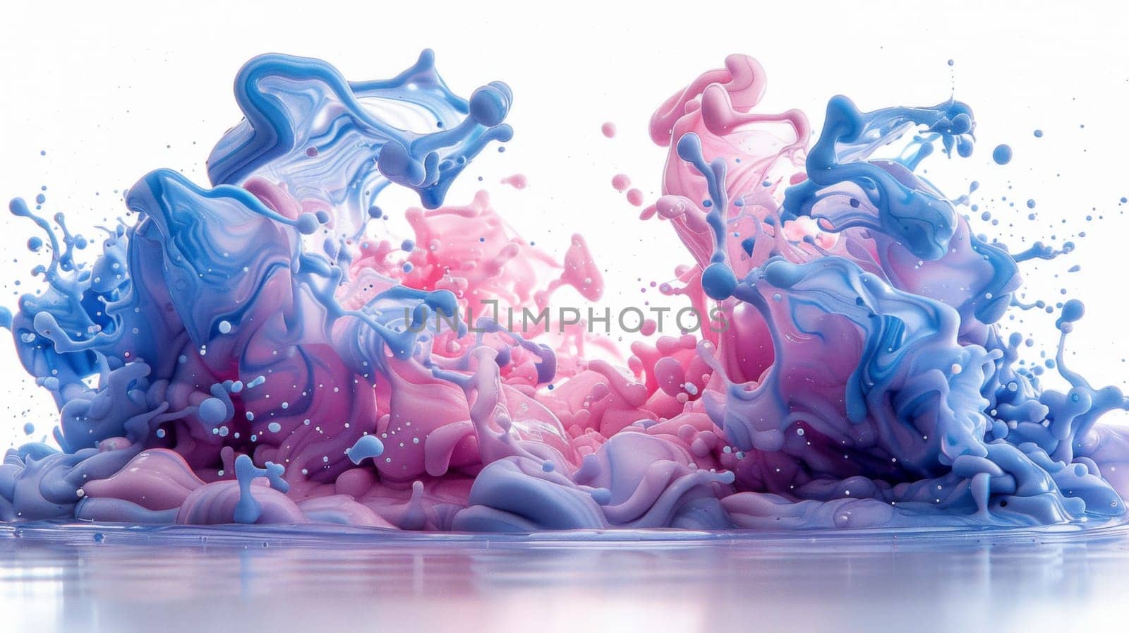 Blue and pink paint swirls and splashes gracefully into the water, creating a mesmerizing and colorful spectacle.