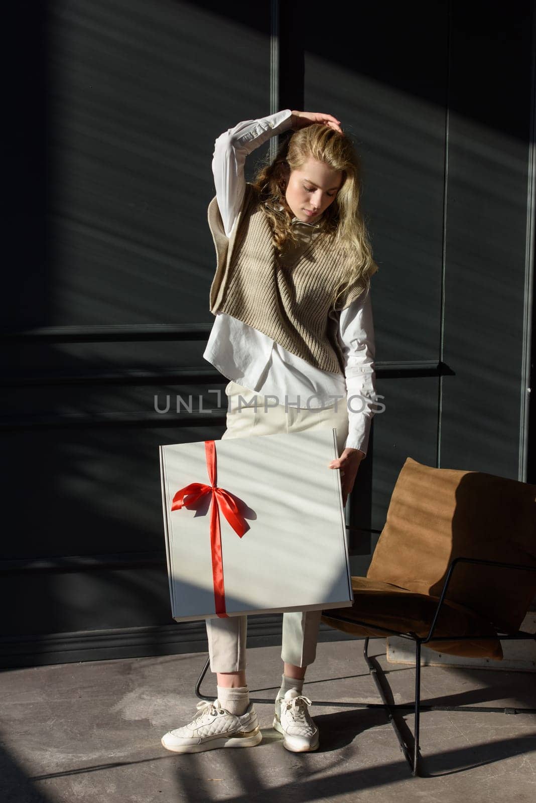 A woman holds a white gift box with a red ribbon by Ashtray25