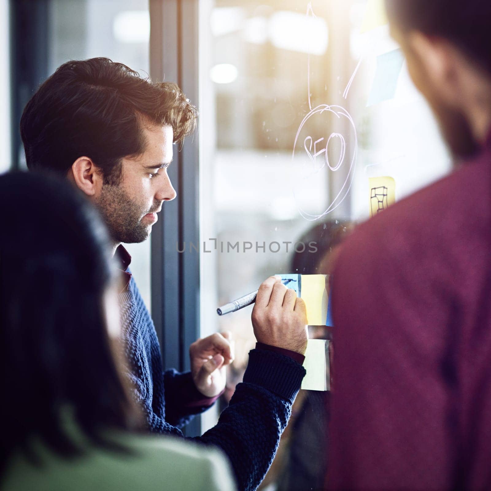 Businessman, sticky notes and writing on glass for planning in office, teamwork and seo idea for solution. Staff, male person and problem solving on wall, support and coach for project brainstorm.