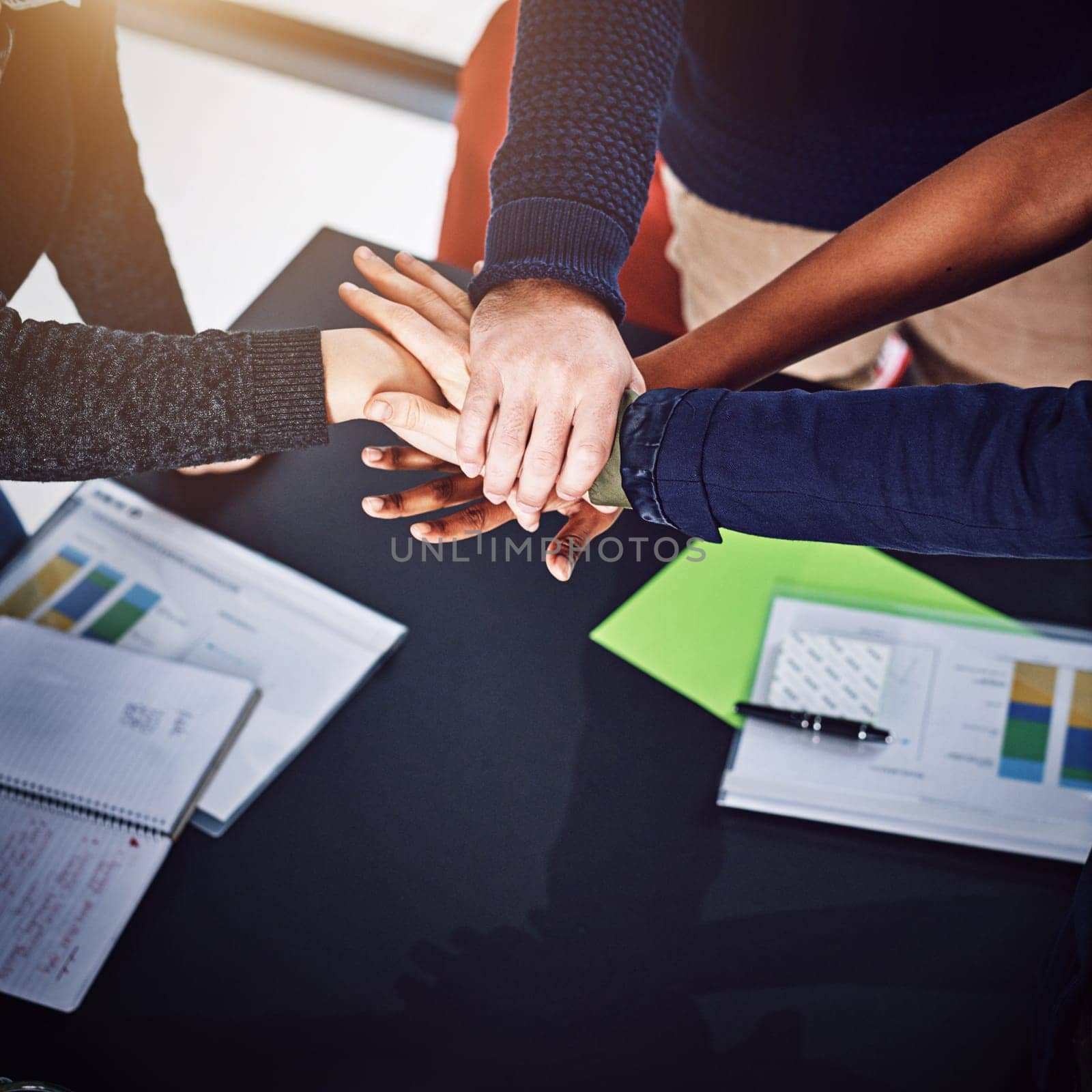 Closeup, meeting or business people with hands in stack for mission goals, collaboration or teamwork. Above, community or employees in cooperation with office support, solidarity or group motivation.