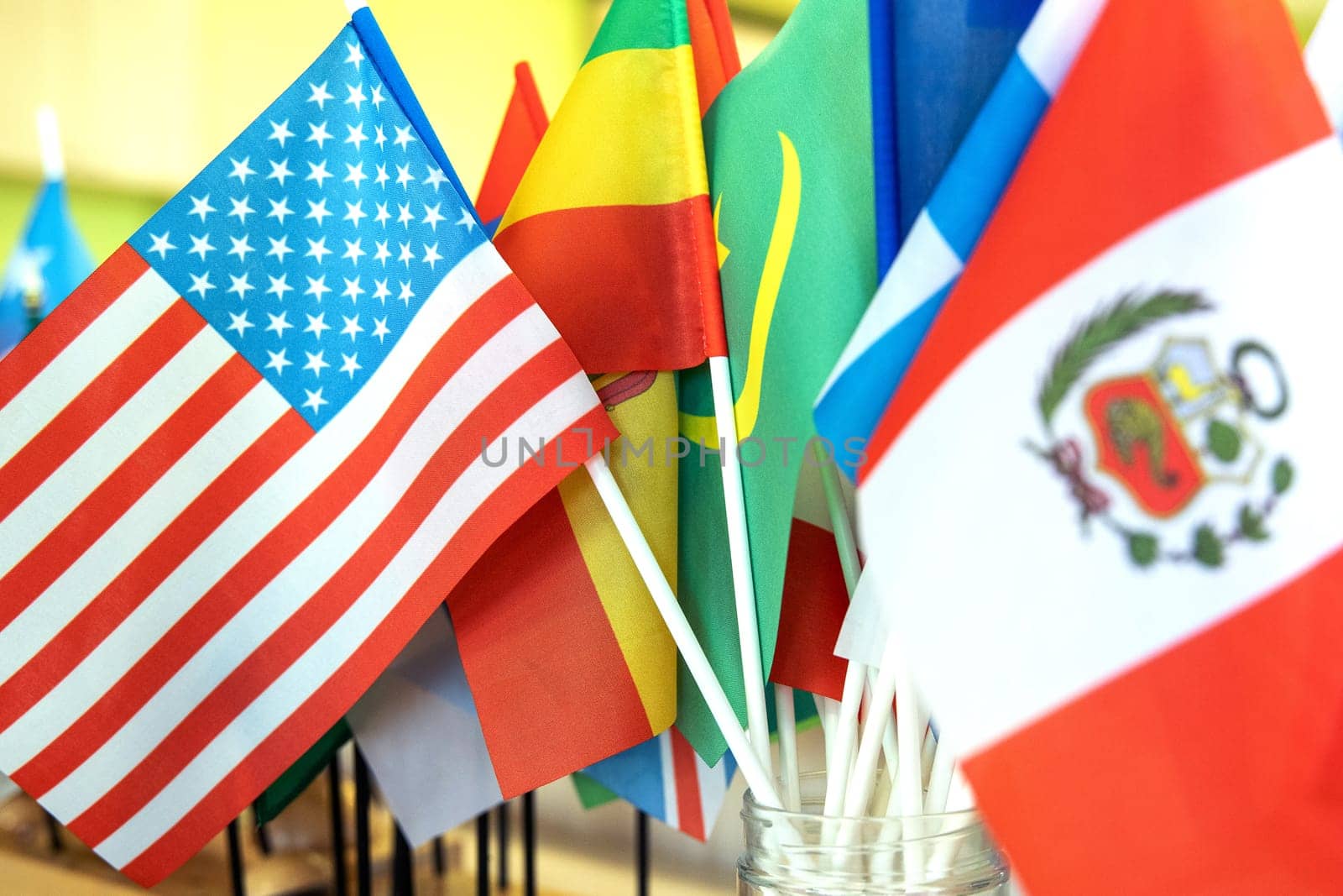 Close-up on the flags of Peru and the USA against the background of other flags of the world by Rom4ek