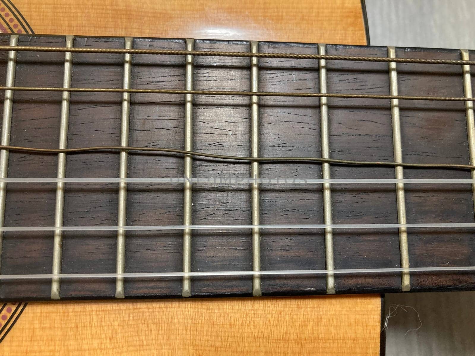 Acoustic guitar and its elements for the playing