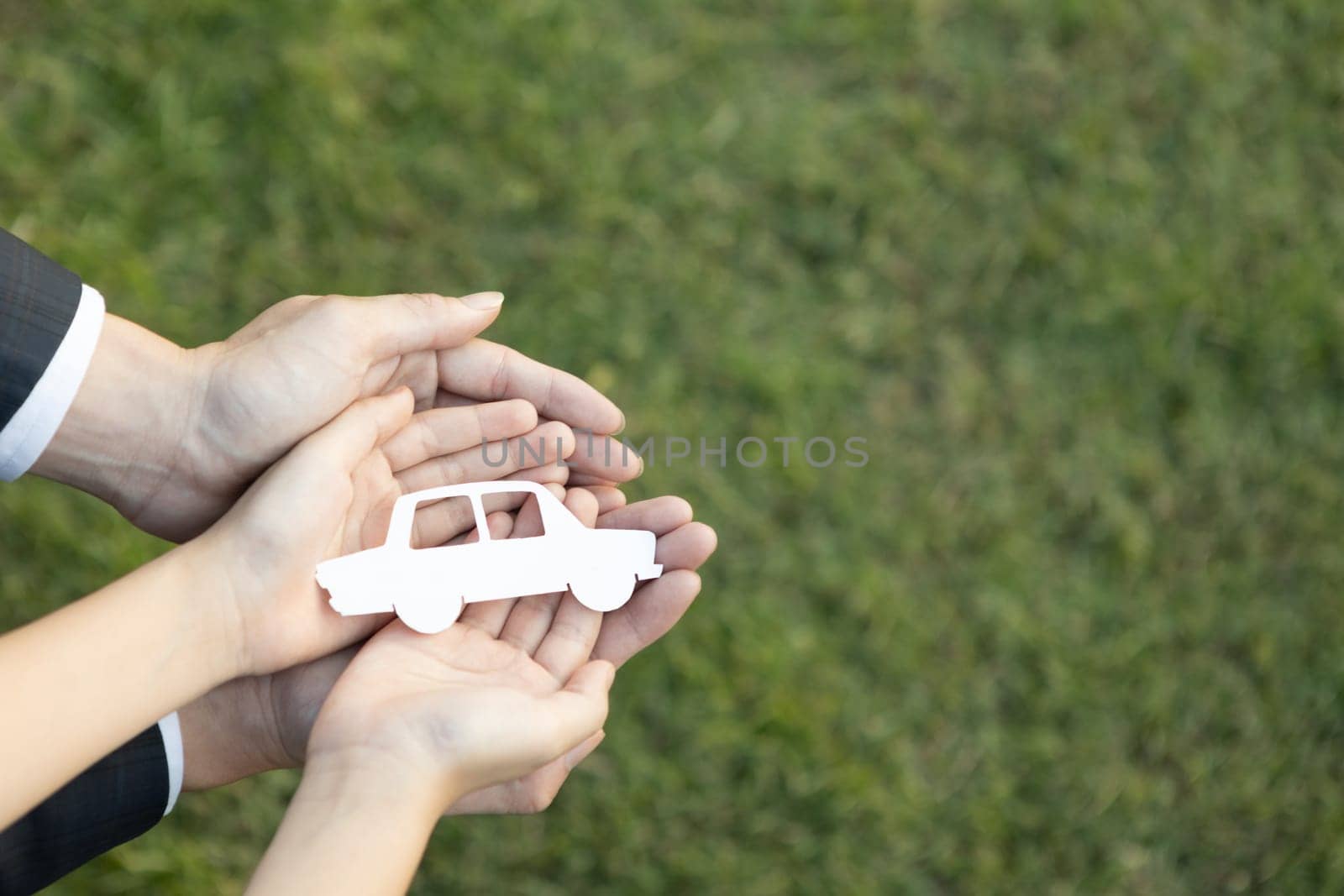 Top view hand holding EV car icon symbolize eco-friendly business corporation committed to environmentally friendly transportation and zero CO2 emission. Corporate responsible and EV technology. Gyre