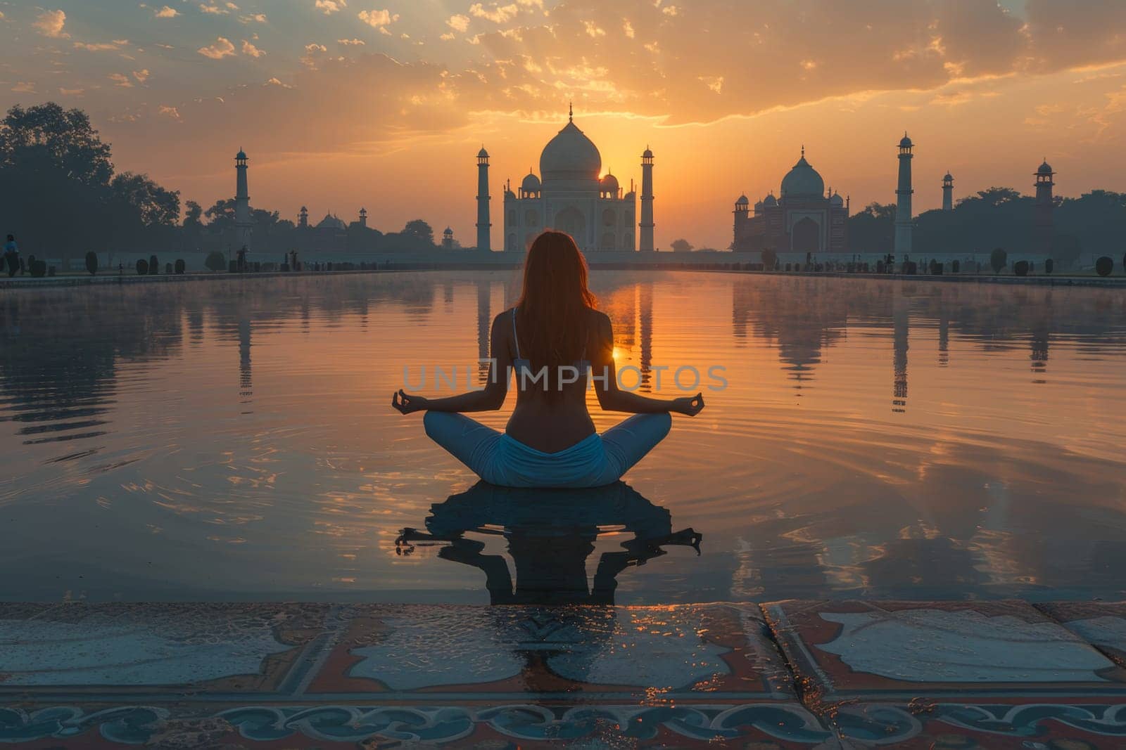 A group of young girls practicing yoga perform Padmasana exercises, lotus position by Lobachad