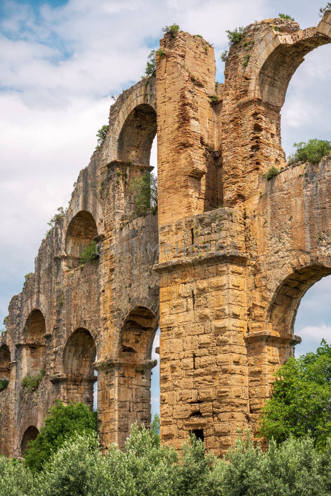 Aqueducts in the ancient city of Aspendos in Antalya, Turkey by Sonat