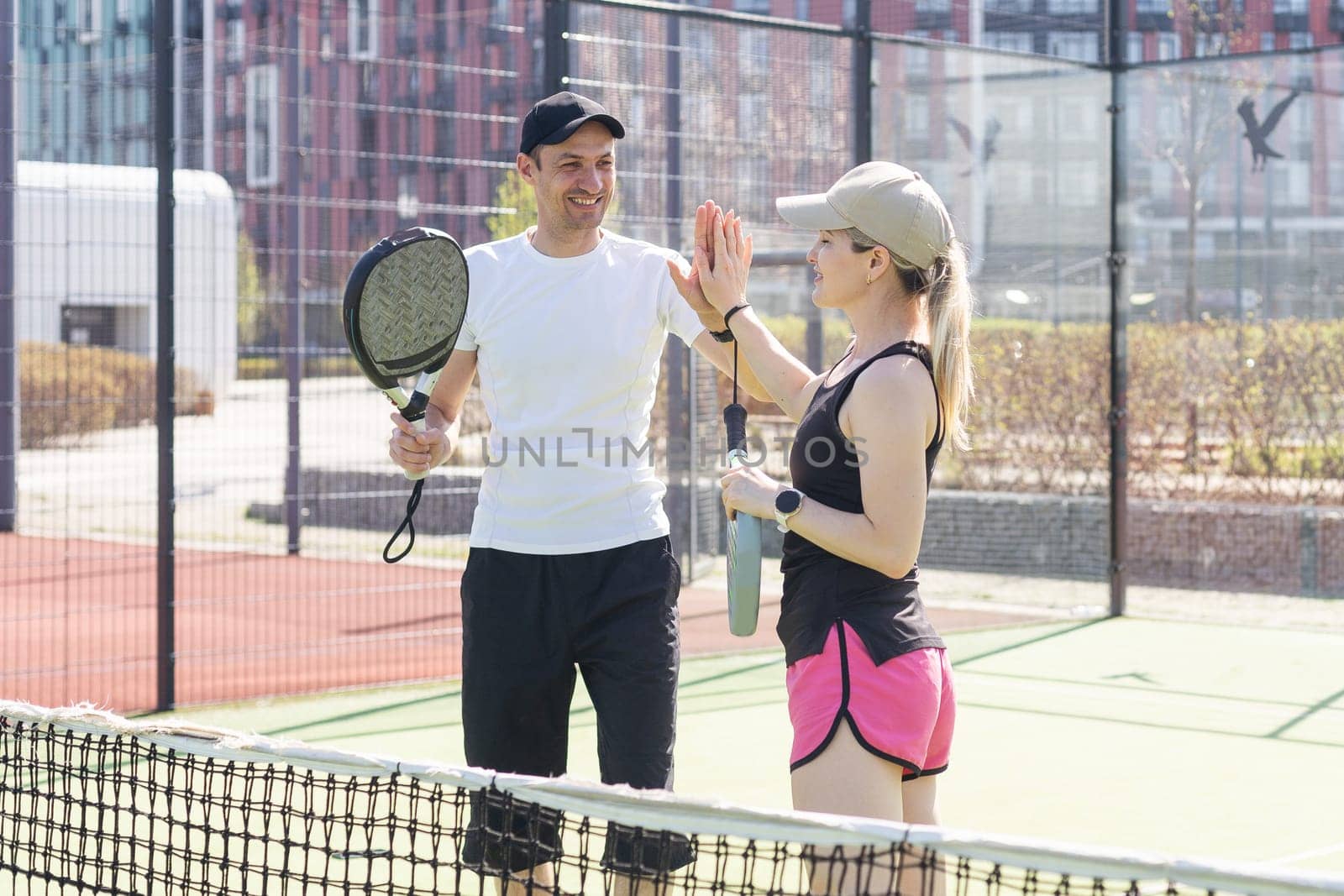 Padel lesson with a coach, personalized instruction in a supportive environment. High quality photo