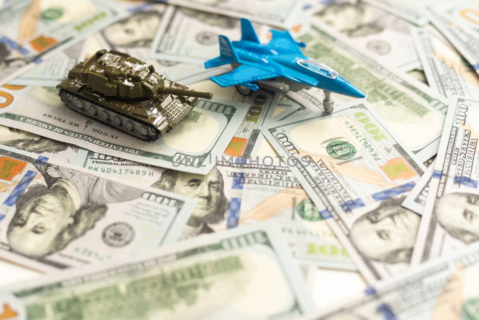 military fighter plane and dollars on a white background. by Andelov13