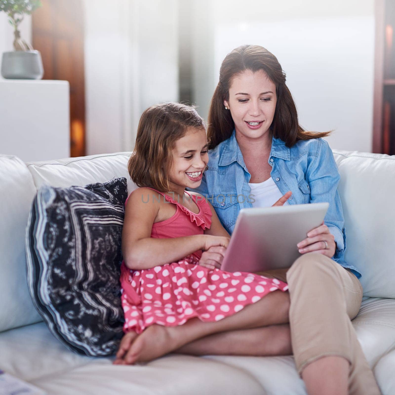 Mother, girl child and relax with tablet for streaming, elearning or online games with bonding or together at family home. Happy, love and woman on break with daughter, connection and ebook with tech.