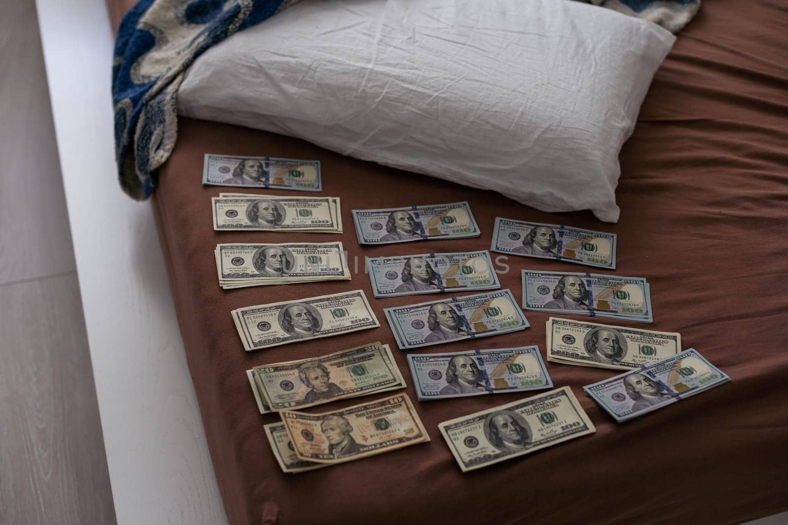 Crime scene, physical evidence. Gun handcuffs, money, dollar on a dark background. High quality photo
