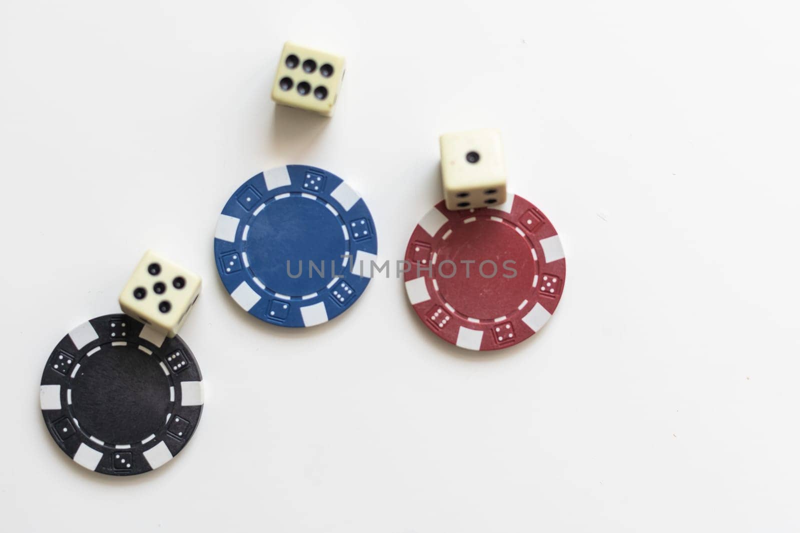 Gambling chips falling isolated on white. High quality photo