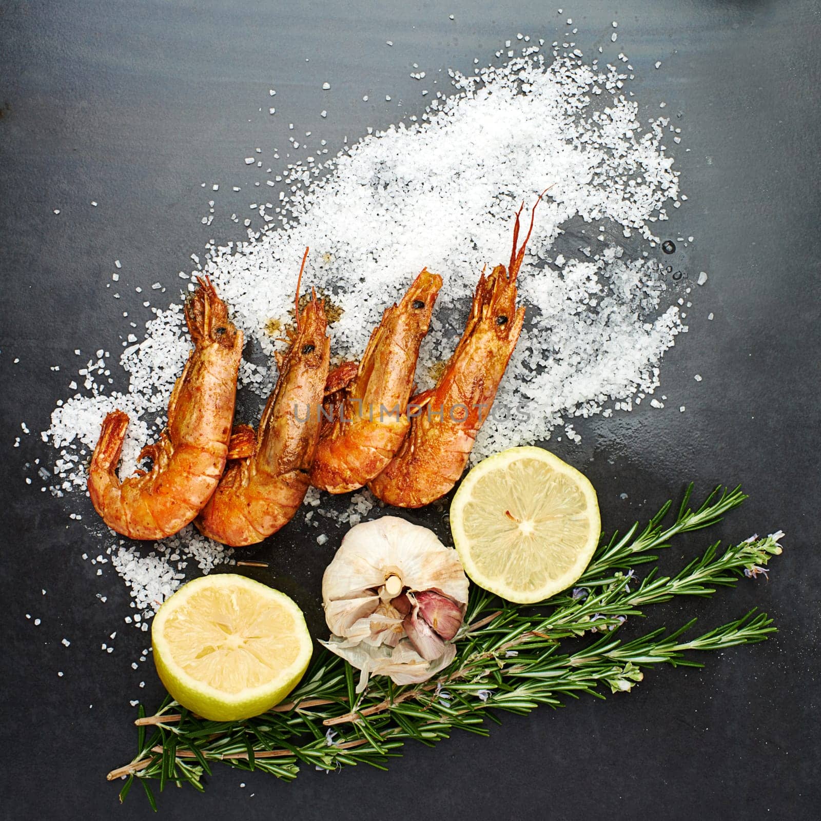 Healthy, food and prawns with herbs on table for natural, organic and nutrition to prepare seafood dish. Pescatarian, fish and protein with minerals to prevent cancer to diet for weight loss.