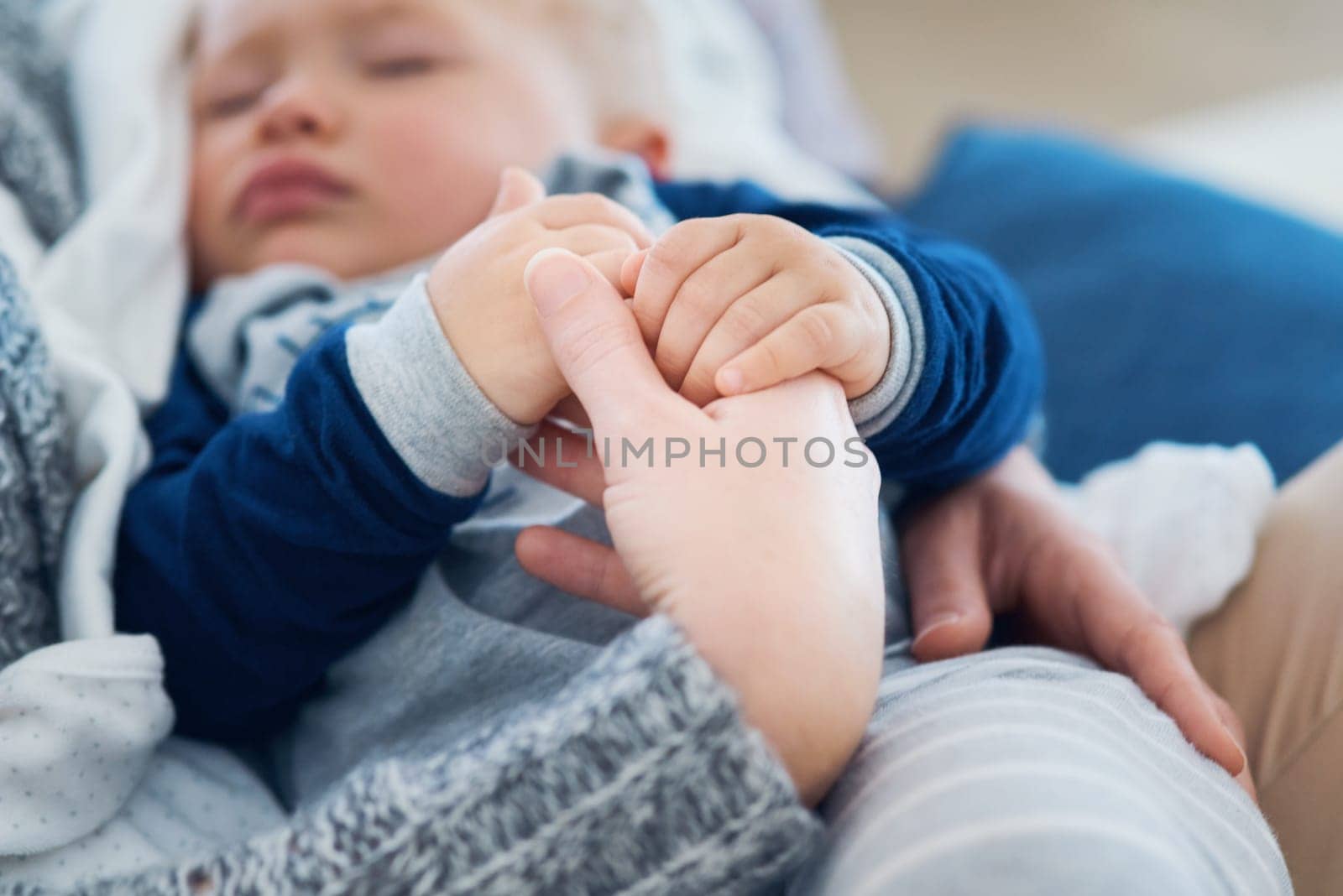 Mommy, baby and sleeping for holding hands in home, security and support in bonding for wellness. Mother, toddler and care for maternity or nap on couch, child development and comfort for single mom.