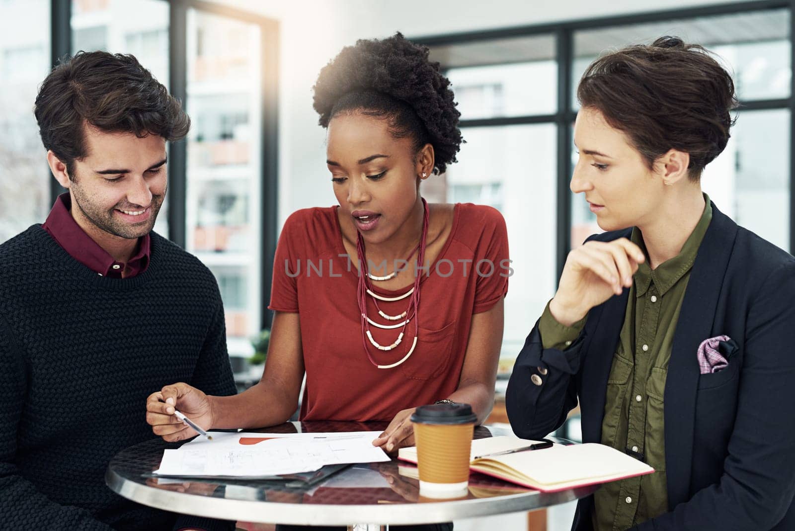 Business people, teamwork and communication .for work, planning or research at a table with coffee and documents. Corporate workers, smile and collaboration on company project with ideas and vision.