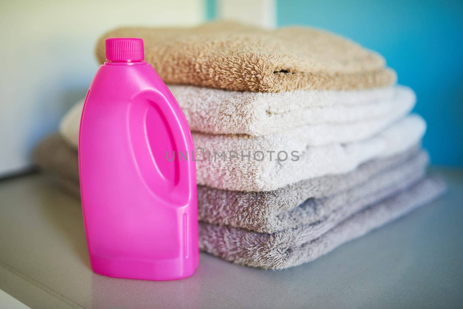 Towels, detergent and washing laundry cleaning or chemical for cotton bacteria, product or household. Cloth, sanitary and folded for neat organizing or linen with soap as service, stack or hygiene.