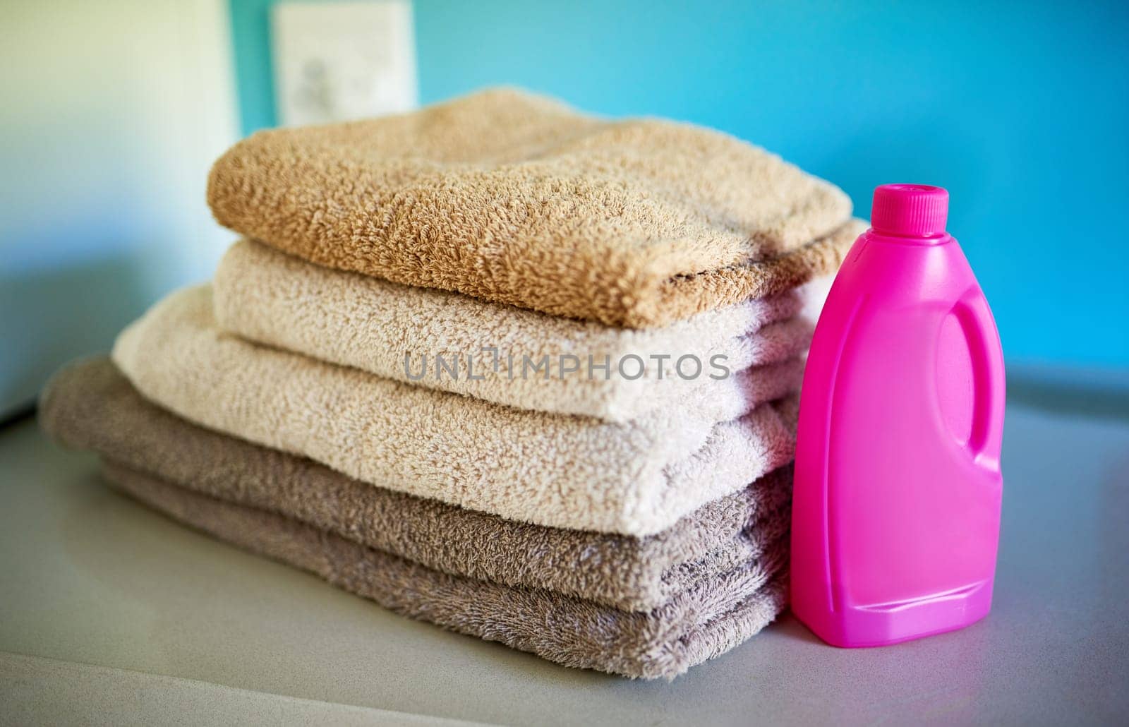 Towels, detergent and washing laundry for hygiene for spring cleaning home or bacteria, product or household. Cloth, sanitary and folded for neat organizing or soft linen cleanser, service or stack.