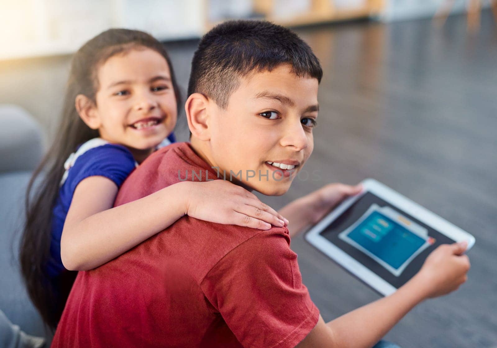 Tablet, kids and portrait with siblings on couch, online and esports for entertainment. Technology, streaming and smile for play on internet in lounge, gaming and digital or mobile app on touchscreen.