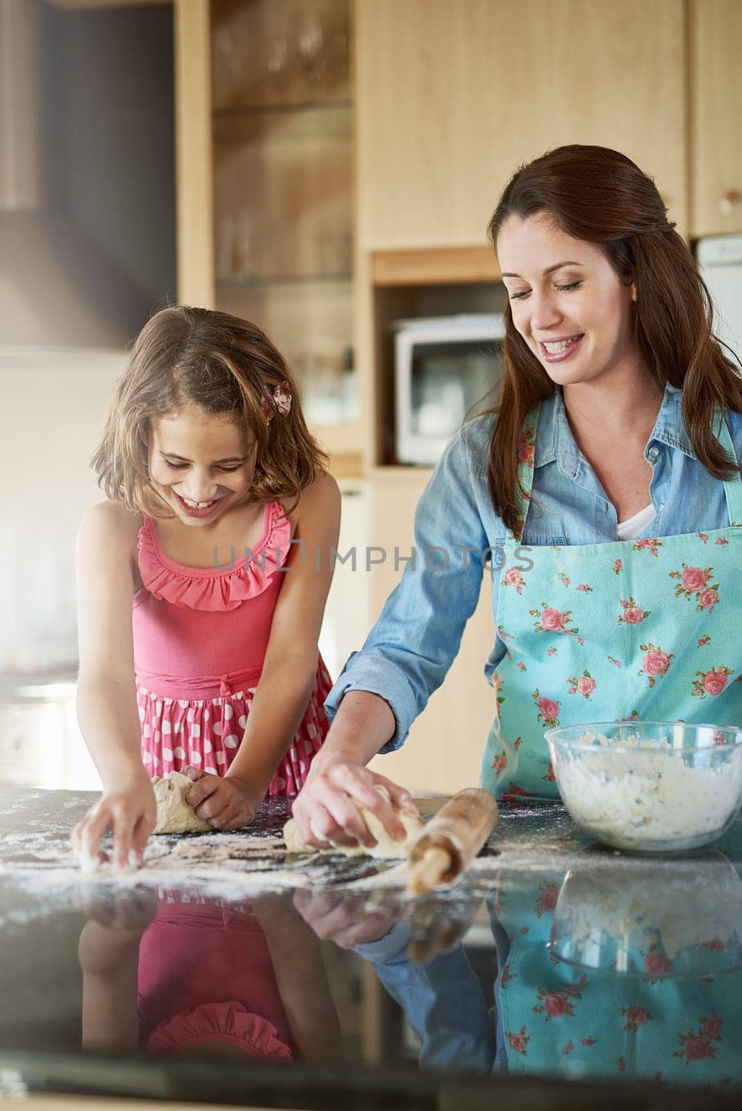 Mother, child and baking dough in kitchen or learning support for breakfast, bread or bonding. Woman, daughter and flour on counter or teaching girl in home for homemade cookies, dessert or happiness.