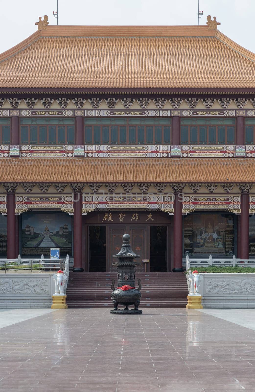 Bangkok, Thailand - Apr 11, 2024 - Exterior architecture of Taiwanese temple style and black incense burner at Fo Guang Shan Thaihua Temple is famous place. The Institute of Buddhism, Space for text, Selective focus.