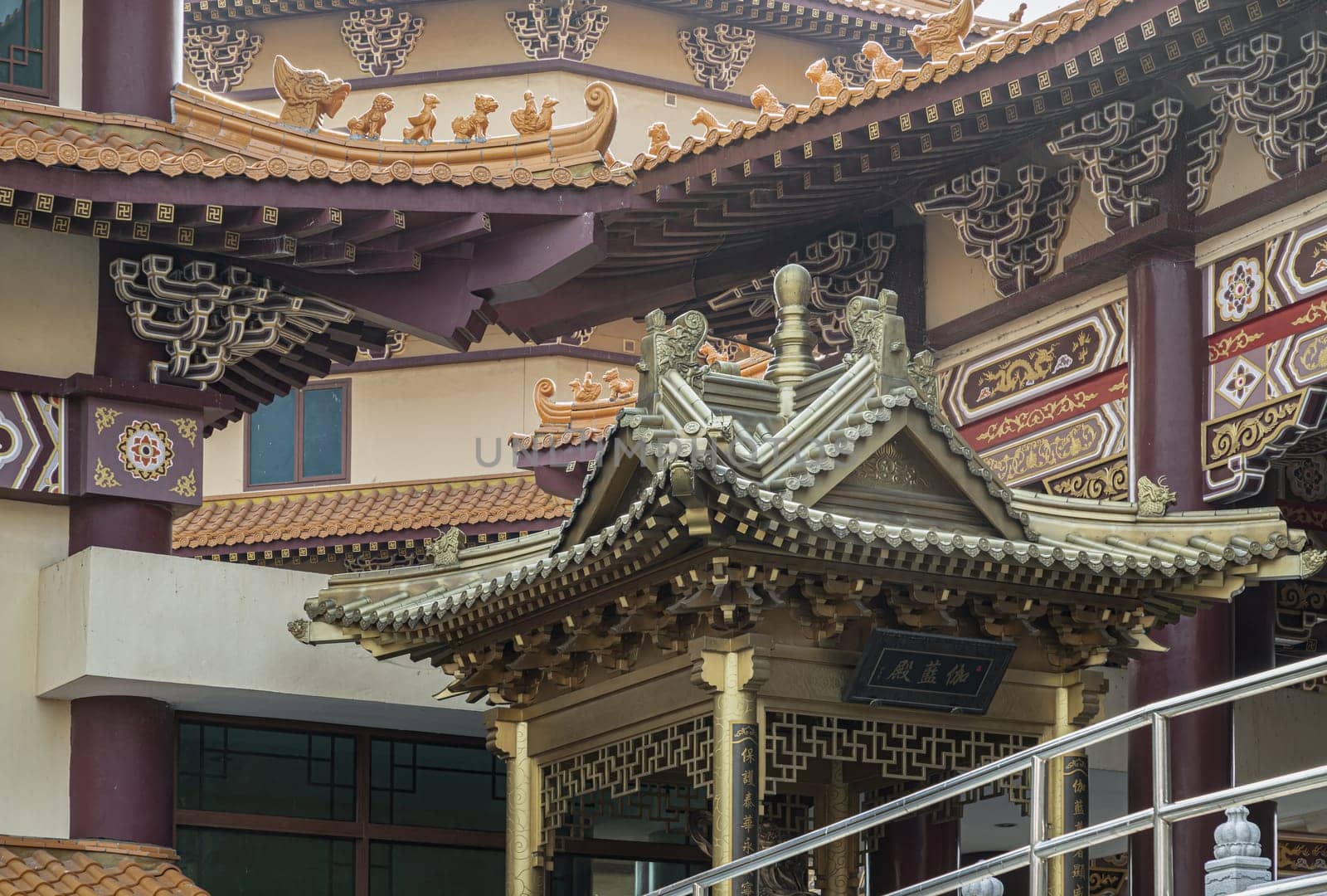 Bangkok, Thailand - Apr 11, 2024 - Golden gable roof architecture inside of Taiwanese temple at Fo Guang Shan Thaihua Temple. Taiwanese temple style, The Institute of Buddhism, Space for text, Selective focus.