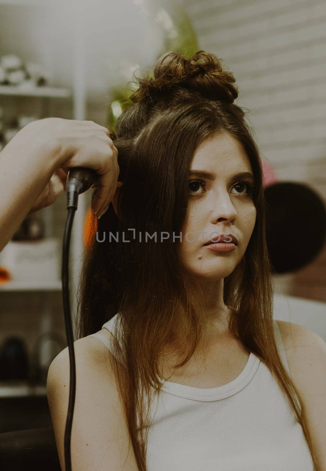 Portrait of a young girl at the hairdresser. by Nataliya