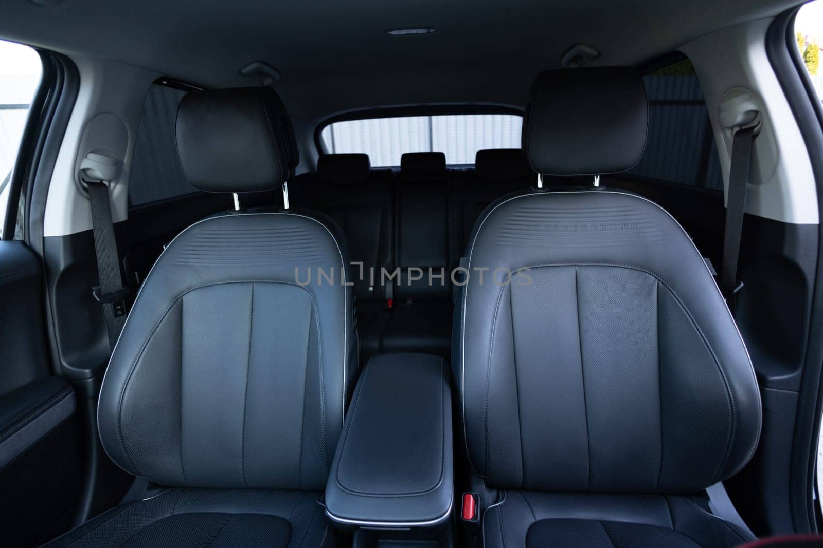 Luxury car leather seats. Interior of new modern clean expensive car. Passenger seats with leather. Closeup details. New car inside. Car cleaning theme.