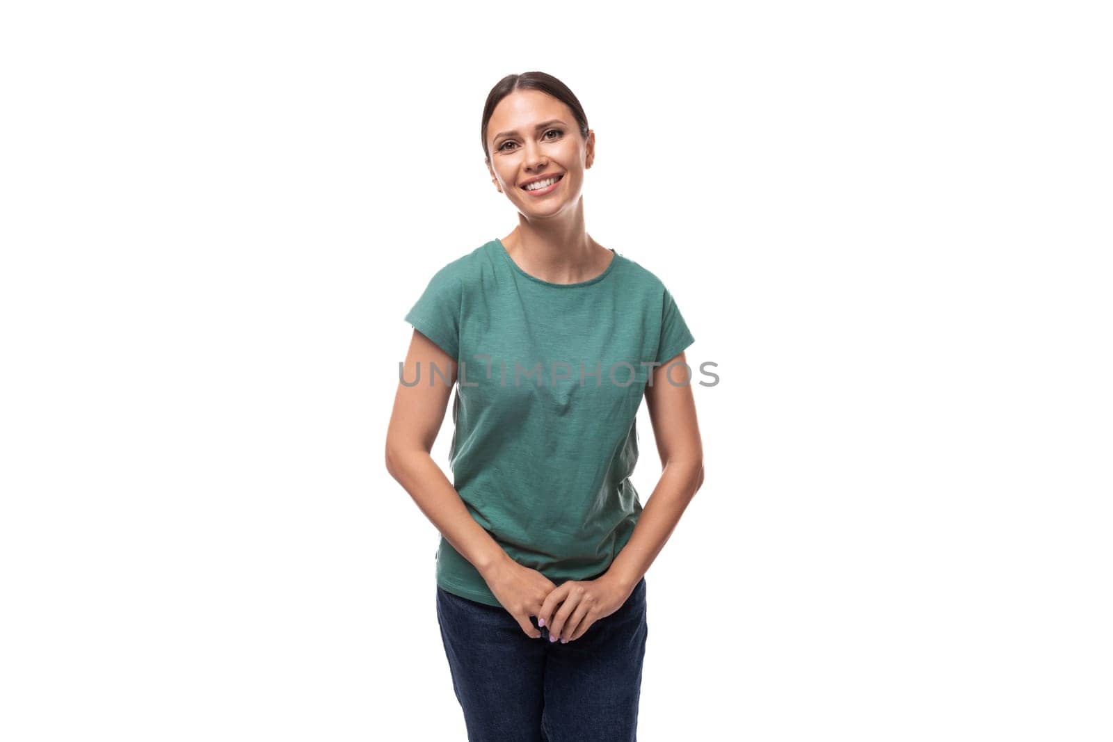 pretty smiling young brunette woman in green t-shirt isolated on white background by TRMK