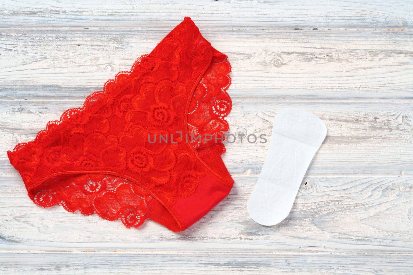 Top view women's underwear panties on a wooden background flat lay