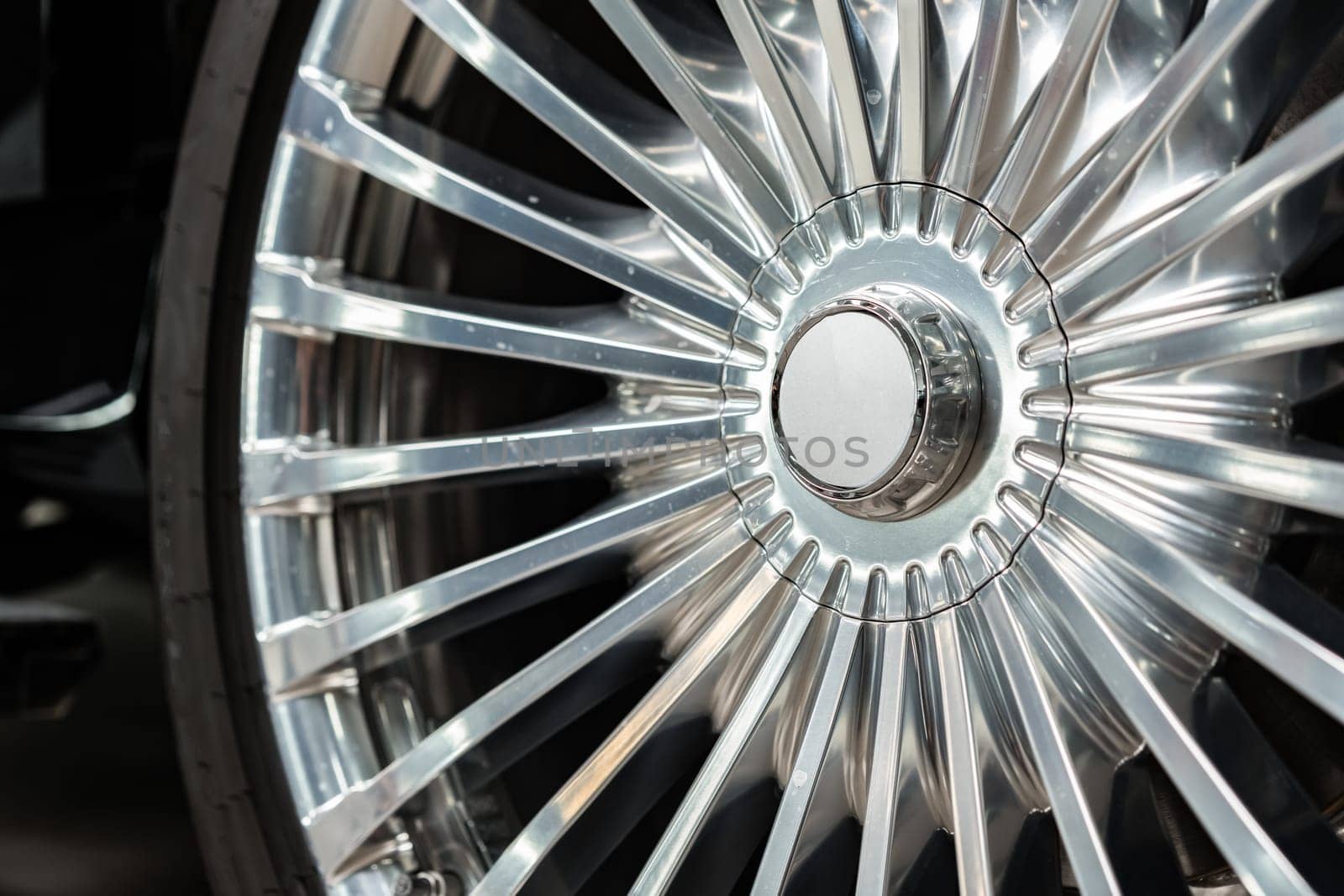 Close up view of a wheel of luxury car in car service