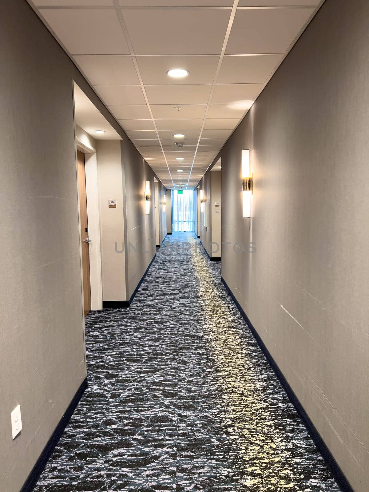 Ft. Collins, Colorado, USA-April 6, 2024-Explore the luxurious ambiance of this hotel hallway adorned with exquisite décor and soft lighting, creating a welcoming atmosphere for guests.